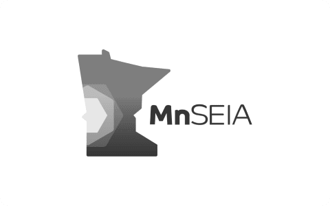 MnSEIA logo showing a stylized Minnesota silhouette with layered hexagon design and "MnSEIA" text to the right